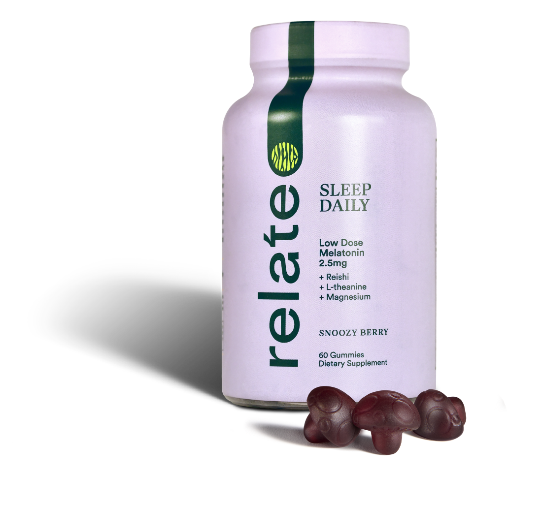 Bottle of Relate Daily Sleep Daily gummies with Snoozy Berry flavor alongside three gummies. They contain low-dose melatonin, reishi, L-theanine, lion's mane, and magnesium.
