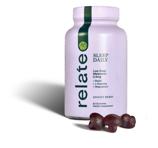 Bottle of Relate Daily Sleep Daily gummies with Snoozy Berry flavor alongside three gummies. They contain low-dose melatonin, reishi, L-theanine, lion's mane, and magnesium.